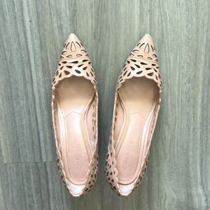 Nude laser-cut pumps